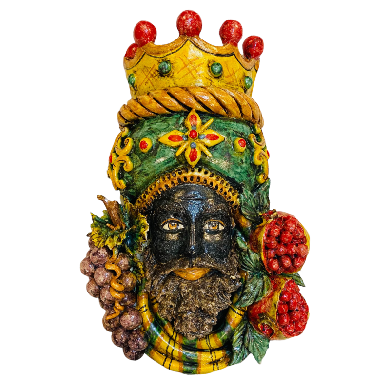Pair of wall hanging Moor's heads, Caltagirone, with crown and fruit, verdigris background, opaque enamel, height about 