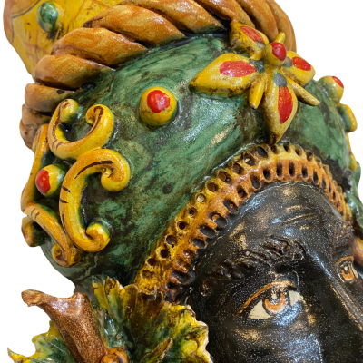 Pair of wall hanging Moor's heads, Caltagirone, with crown and fruit, verdigris background, opaque enamel, height about 