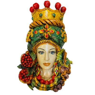 Pair of wall hanging Moor's heads, Caltagirone, with crown and fruit, verdigris background, opaque enamel, height about 