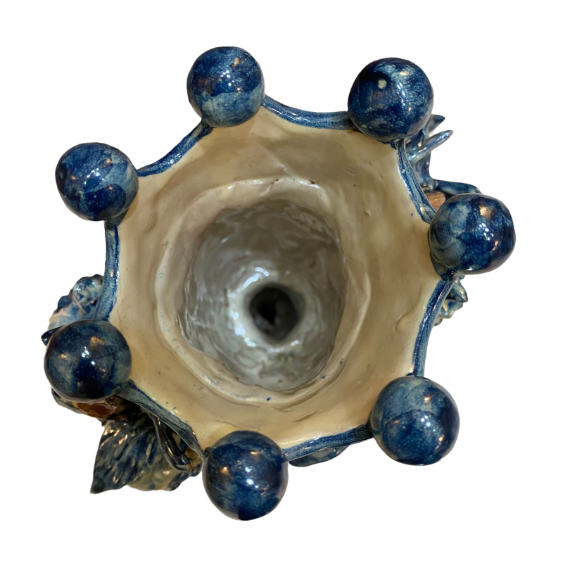 Two-faced Janus head with two faces Caltagirone ceramic candlestick, antique blue background - 