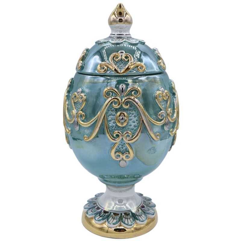 Egg in Caltagirone ceramic in Fabergè style with reliefs in 24k pure gold enamel, copper green, height approx. 28cm. Mod