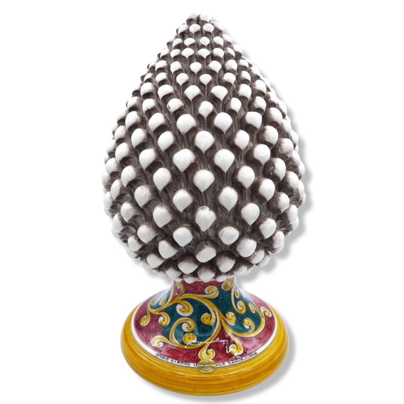Sicilian pine cone in Antiqued White Caltagirone ceramic, stem with baroque decoration on a green & red background, h 40
