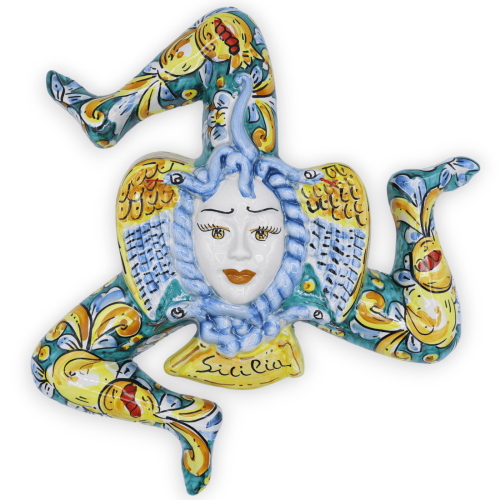 Trinacria in ceramica Caltagirone, h 34 cm x 33 l ca. decoro barocco e frutta, fondo verde - 