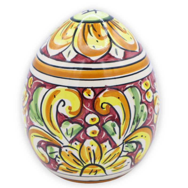 Huevo de cerámica Caltagirone, decoración barroca sobre fondo burdeos, h 15 y Ø 13 cm aprox. modelo FL - 