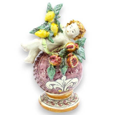 Putto on esfera com frutas em cerâmica Caltagirone - h 19 cm aprox. (1pc) em diferentes opções de decoração - 