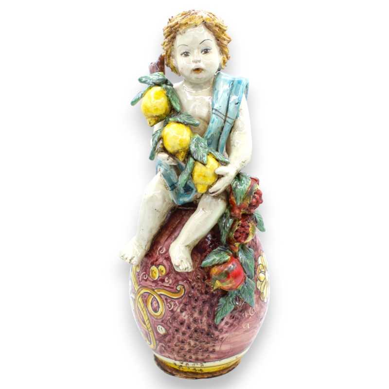 Putto sur œuf avec bouquet de citrons et grenades, céramique Caltagirone - h 36 cm environ. Bordelais et baroque - 