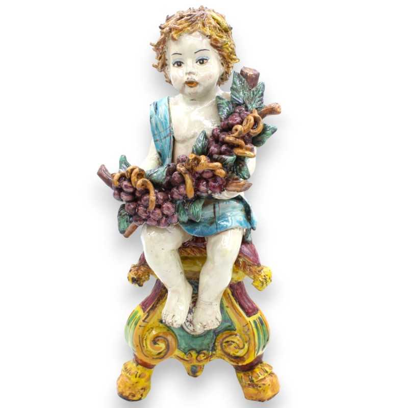 Putto on a baroque base with bunch of grapes, Caltagirone ceramic - h 33 cm approx. Bordeaux and green - 