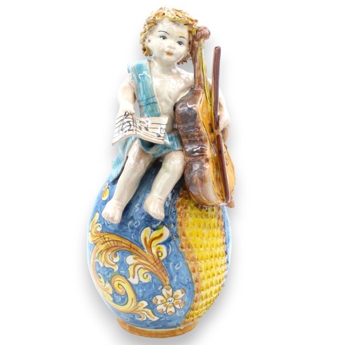 Putto na jajku z wiolonczelą i partyturą, ceramika Caltagirone - wys. 33 cm ok. niebieski i barokowy - 
