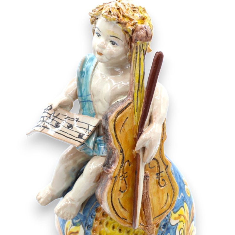 Putto em ovo com violoncelo e partitura, cerâmica Caltagirone - h 33 cm aprox. azul e barroco - 