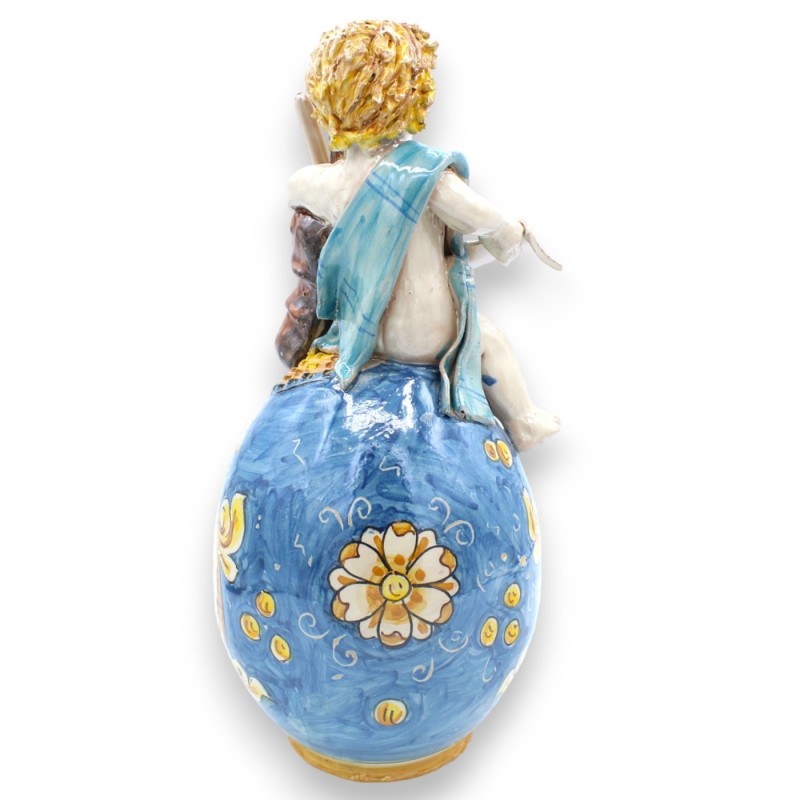 Putto em ovo com violoncelo e partitura, cerâmica Caltagirone - h 33 cm aprox. azul e barroco - 