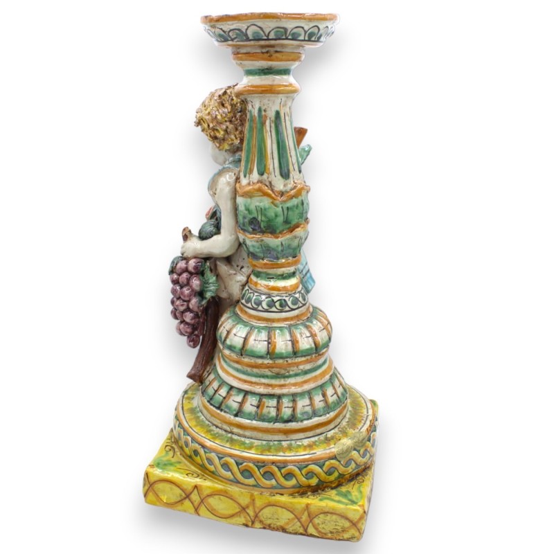 Putto con doppia base e porta candela, ceramica Caltagirone h 38 cm ca. Melagrane e Uva - 
