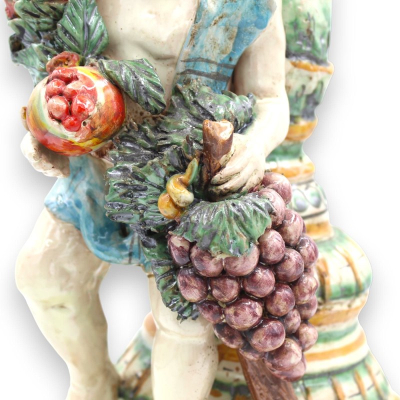 Putto con doppia base e porta candela, ceramica Caltagirone h 38 cm ca. Melagrane e Uva - 