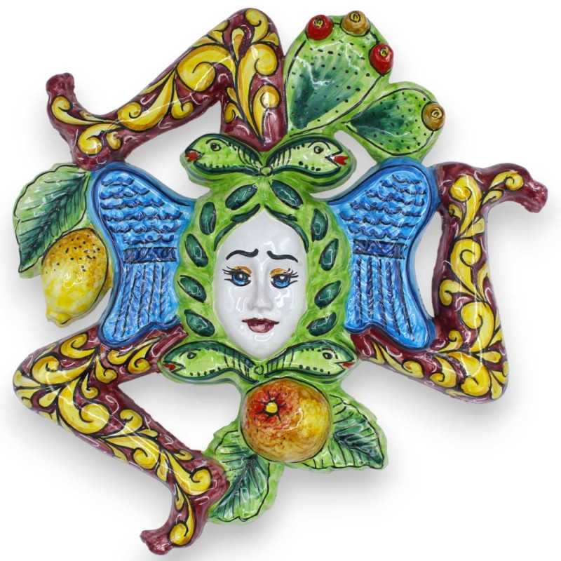 Trinacria in ceramica Siciliana - h 30 x 30 cm ca. fondo Bordeaux, decoro frutta e pale ficodindia - 