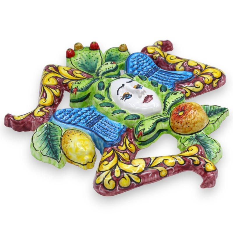 Trinacria in Sicilian ceramic - h 30 x 30 cm approx. Bordeaux background, fruit decoration and prickly pear blades - 