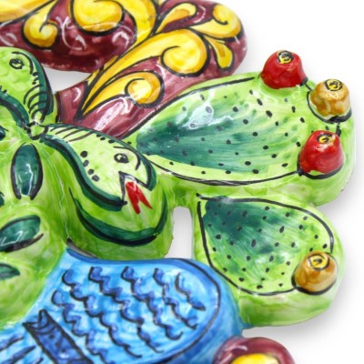 Trinacria in Sicilian ceramic - h 30 x 30 cm approx. Bordeaux background, fruit decoration and prickly pear blades - 