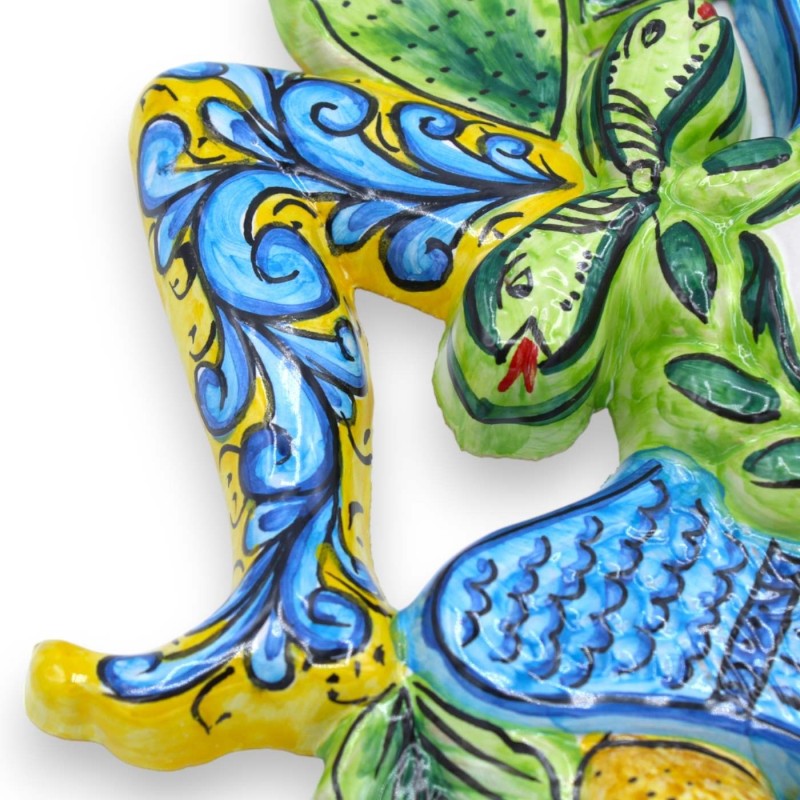 Trinacria in Sicilian ceramic - h 30 x 30 cm approx. Yellow background, fruit decoration and prickly pear blades - 