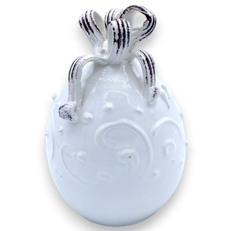 White egg with ribbon in fine ceramic, h approx. 15 cm. Baroque style decoration in relief - 