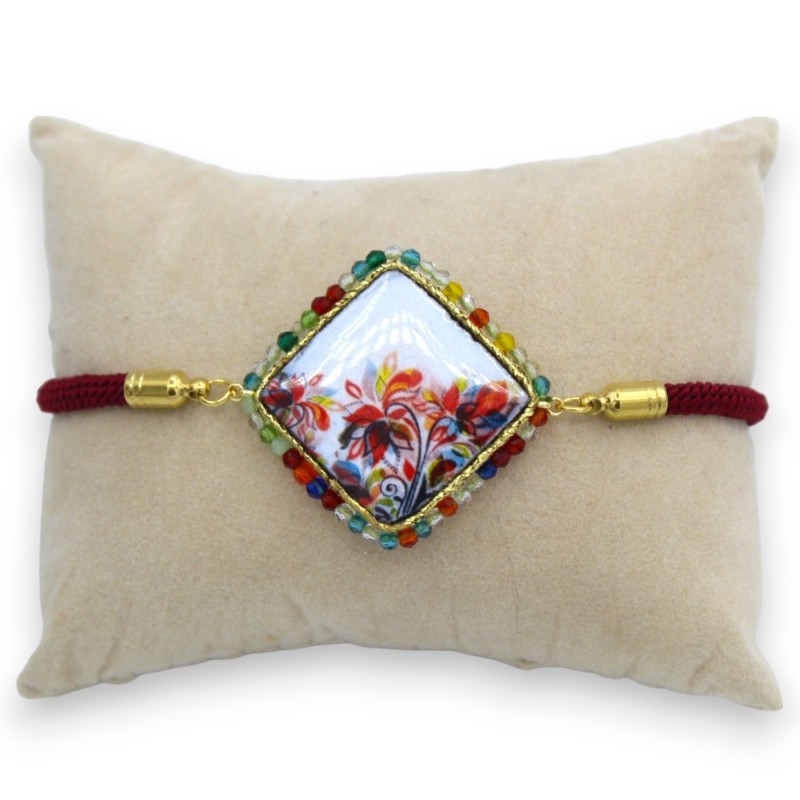 Armband med lavastenskakel, Bordeaux tygsnöre, L ca 25 cm. MD2 stålförslutning - 
