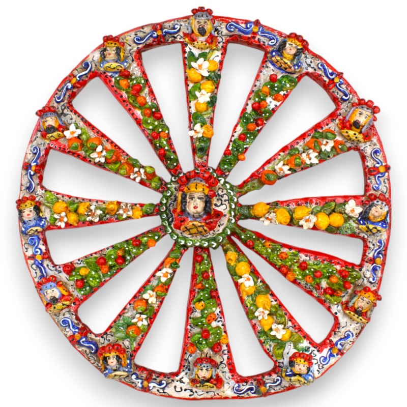 Siciliaans wagenwiel van fijn keramiek, met applicaties van fruit en bloemen op een rode achtergrond, Ø 37 cm ca. - 