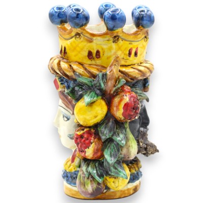 Cabeça de Janus Bifrons com duas faces em cerâmica de Caltagirone, altura 18 cm aprox. Coroa, trança e fruto, fundo azul