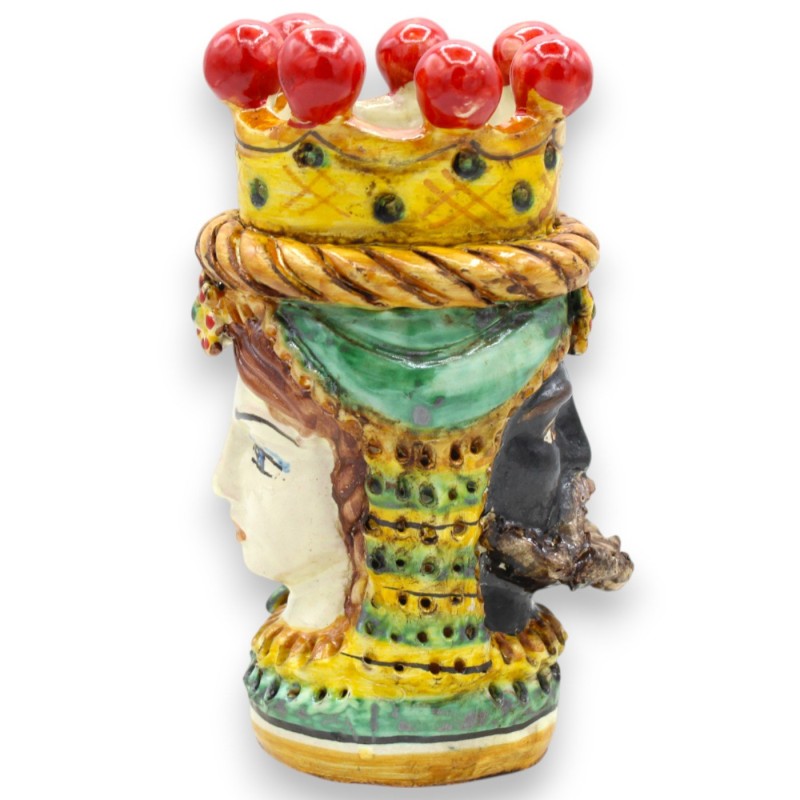 Janus Bifrons head with two faces in Caltagirone ceramic, h 18 cm approx. Crown, braid and fruit, green background - 