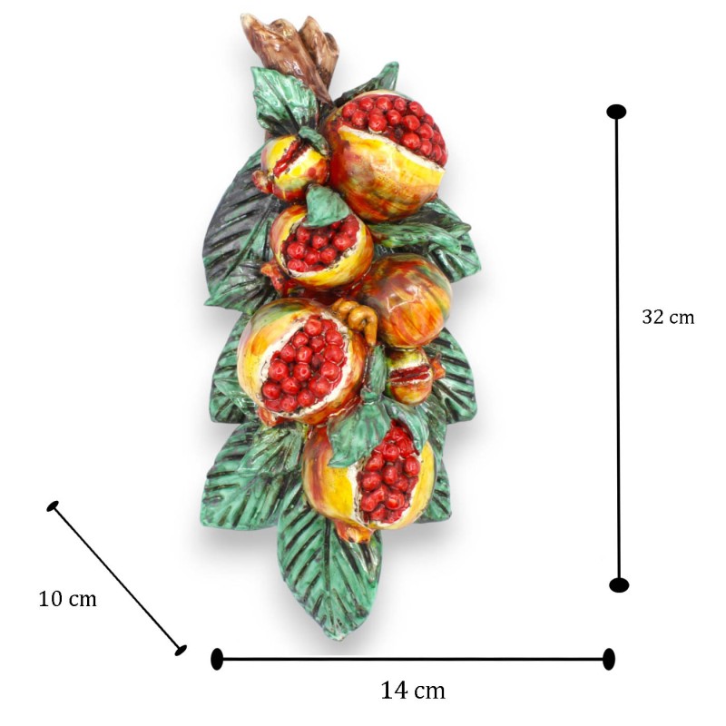 Hanging bundle of pomegranates, in...