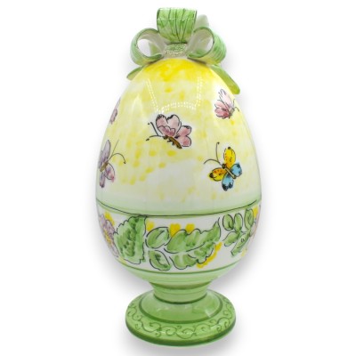 Egg with stem, in fine ceramic, h 33 x Ø 17 cm approx. with applications, floral decoration and butterflies