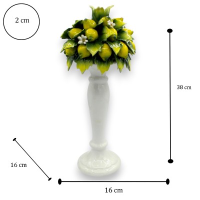 Kandelaar van fijn keramiek, ca. 38 cm hoog x 16 cm breed. Versierd met citroentrossen, oranjebloesem en bladeren.