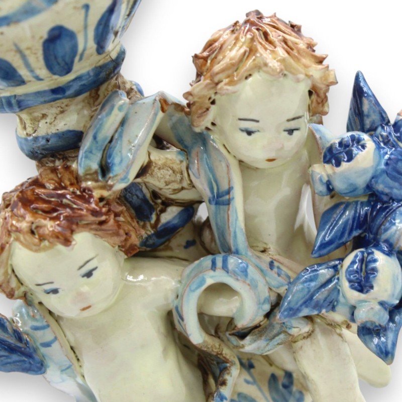 Porta candela con putti in ceramica...