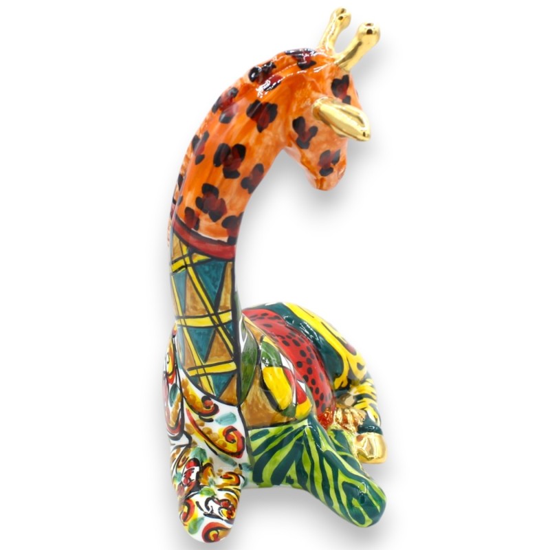 Sitzende Giraffe,...