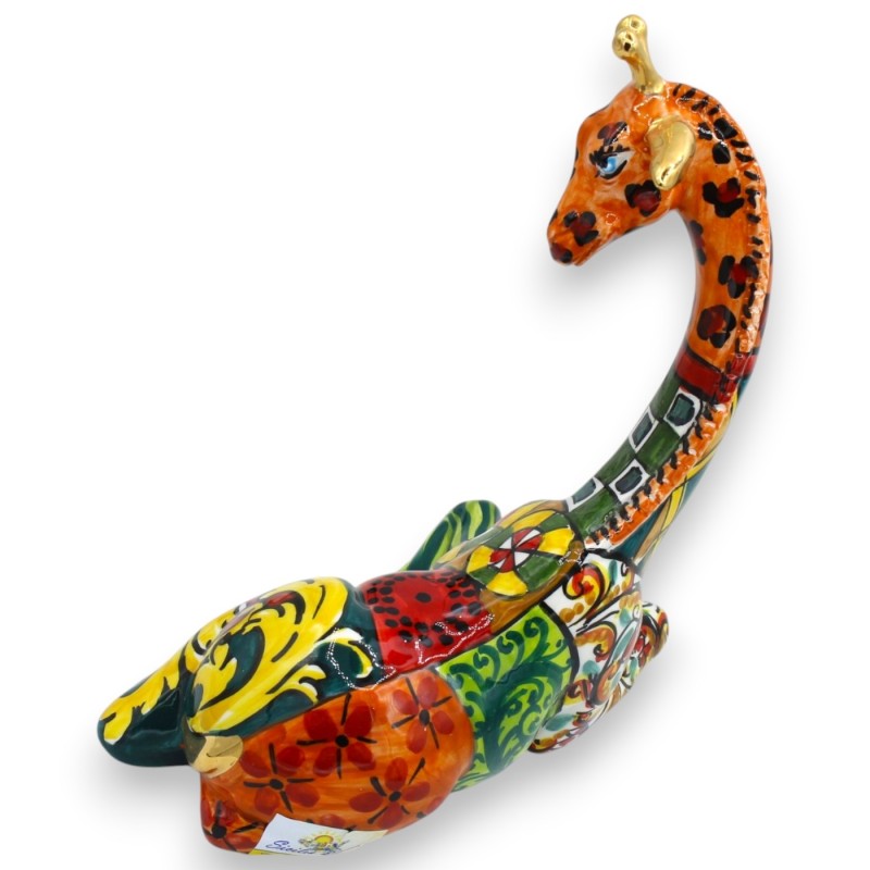 Sitzende Giraffe,...