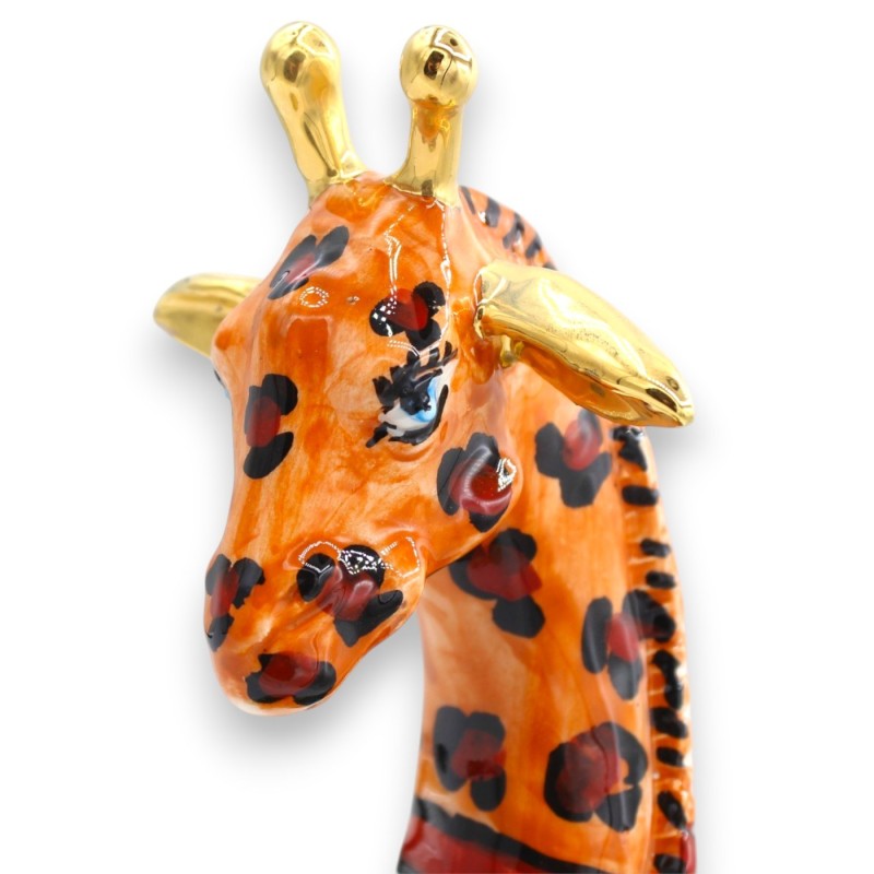 Sitzende Giraffe,...